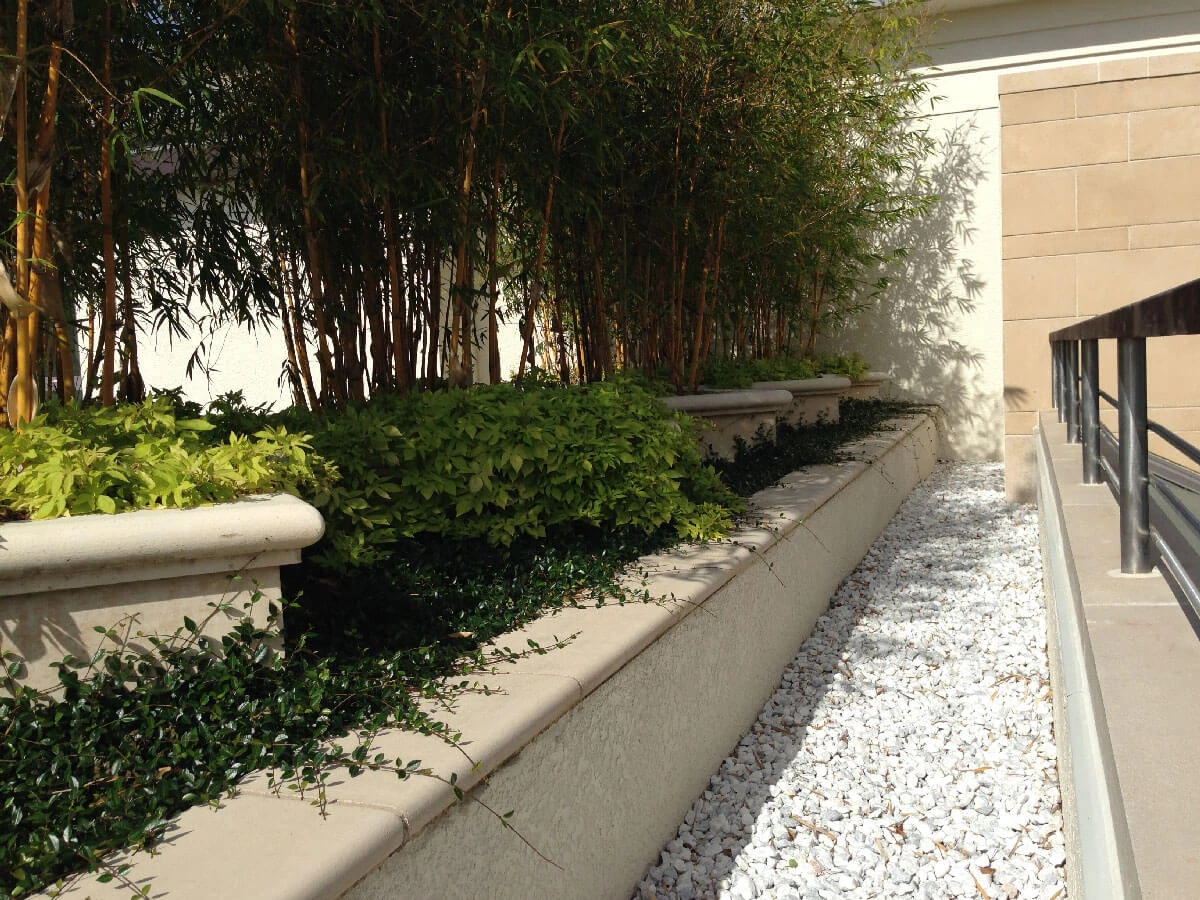Moorings Park Planters, Coping and Wall Veneer in Fiddlesticks Color Acid Wash Finish